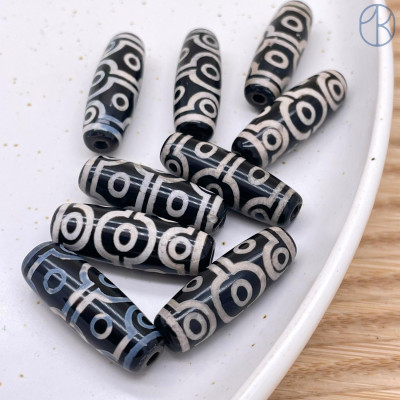 Бусина Дзи 10 глаз черно-белый бочонок 30*11 мм Бусина Дзи 10 глаз черно-белый бочонок 30*11 мм