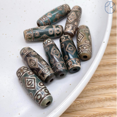 Бусина Дзи 19 глаз коричнево-зеленый бочонок 30*11 мм Бусина Дзи 19 глаз коричнево-зеленый бочонок 30*11 мм