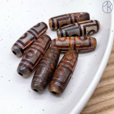 Бусина Дзи 4 глаза серо-коричневый бочонок 30х11 мм