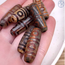 Бусина Дзи 4 глаза серо-коричневый бочонок 30х11 мм