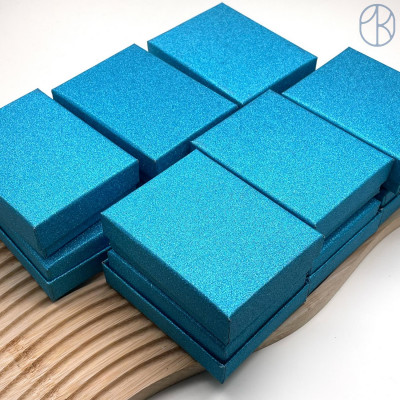 Коробка Голубая блестки 9x7x3 см упаковка 12 шт. Коробка Голубая блестки 9x7x3 см упаковка 12 шт.